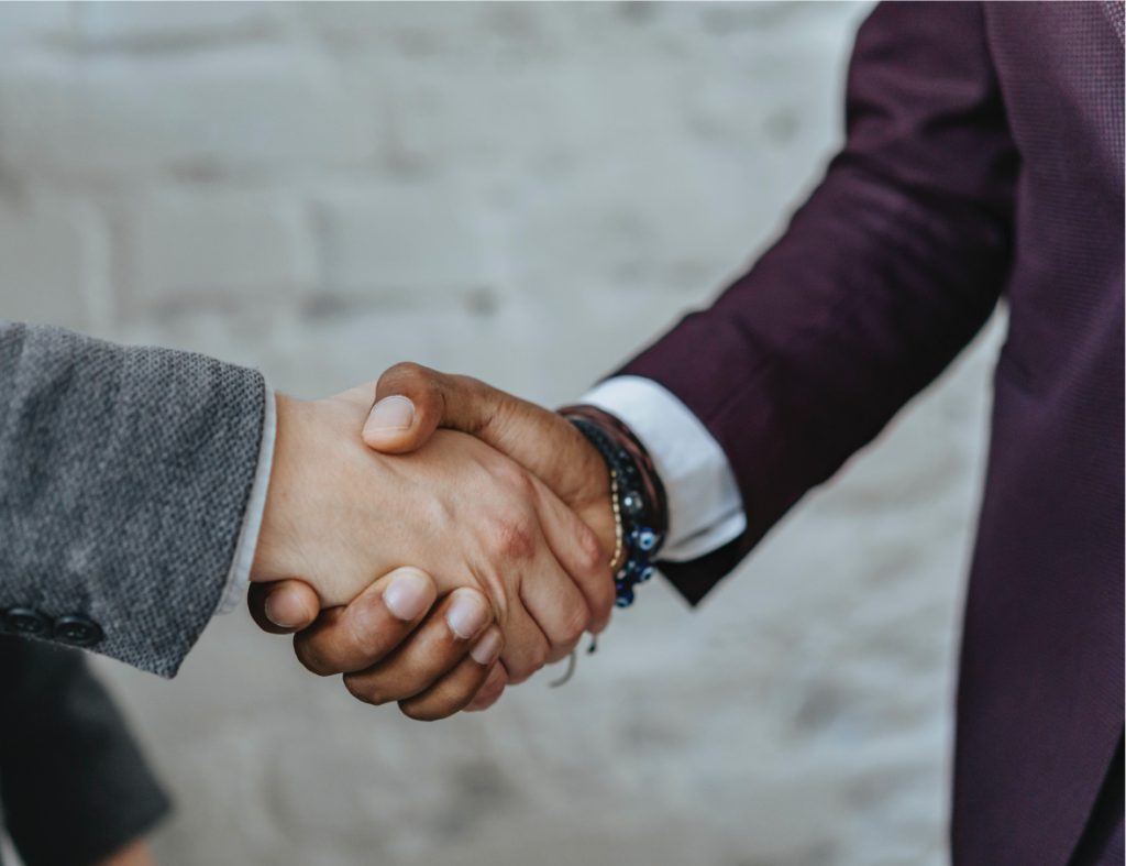 two people shaking hands