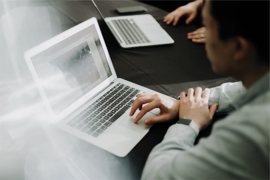 businessman typing on laptop