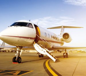 private plane on a sunny runway awaiting passengers